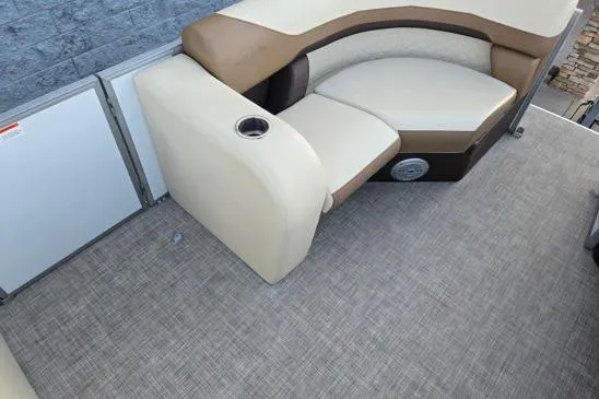 Slide: The Image of 2022 Lowe SS210 boat interior with beige seating and textured flooring. - 4