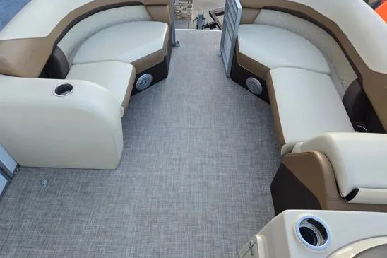 Slide: The Image of 2022 Lowe SS210 boat interior with beige and brown seating, cup holders, and carpeted floor. - 5