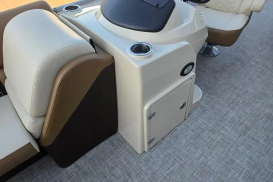 Slide: The Image of 2022 Lowe SS210 boat interior with beige seating and console. - 6