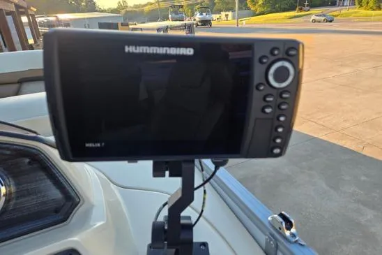 Slide: The Image of Fishfinder on 2022 Lowe SS210 boat dashboard in a marina setting. - 9