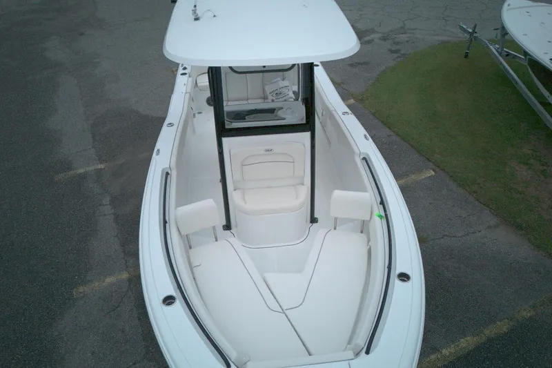 Slide: The Image of 2026 Seahunt 245 boat, aerial view of spacious white interior and seating. - 3