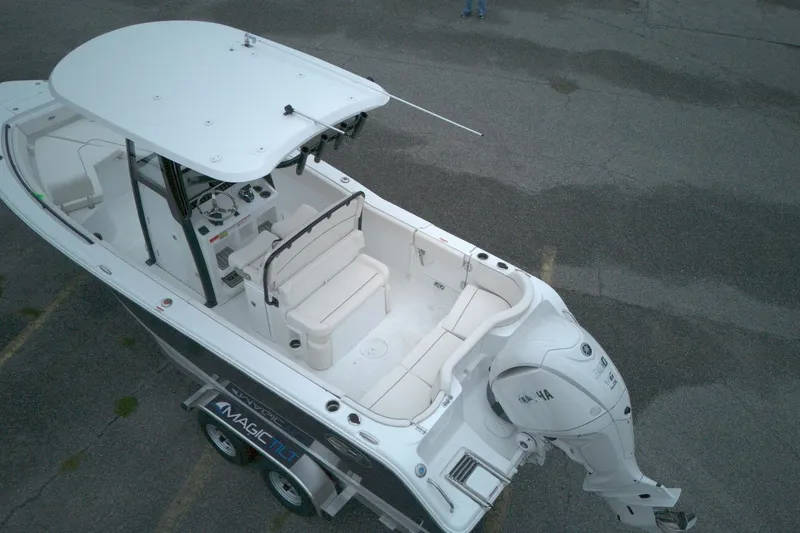 Slide: The Image of Aerial view of 2026 Seahunt 245 boat on trailer, featuring spacious seating and Yamaha outboard motor. - 6
