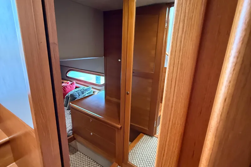 Slide: The Image of Interior of 2017 Grand Banks 44 Eastbay SX with wooden cabinetry and cozy cabin space. - 105