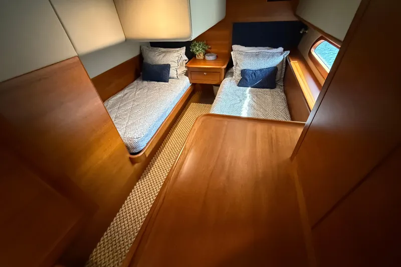 Slide: The Image of 2017 Grand Banks 44 Eastbay SX interior with wood cabinetry and bathroom view. - 110