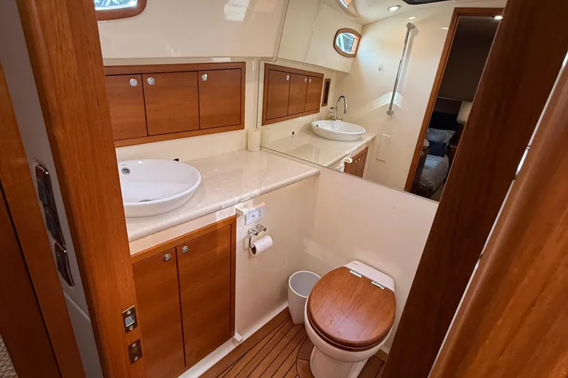 Slide: The Image of Luxurious bathroom in 2017 Grand Banks 44 Eastbay SX yacht with wooden accents. - 113