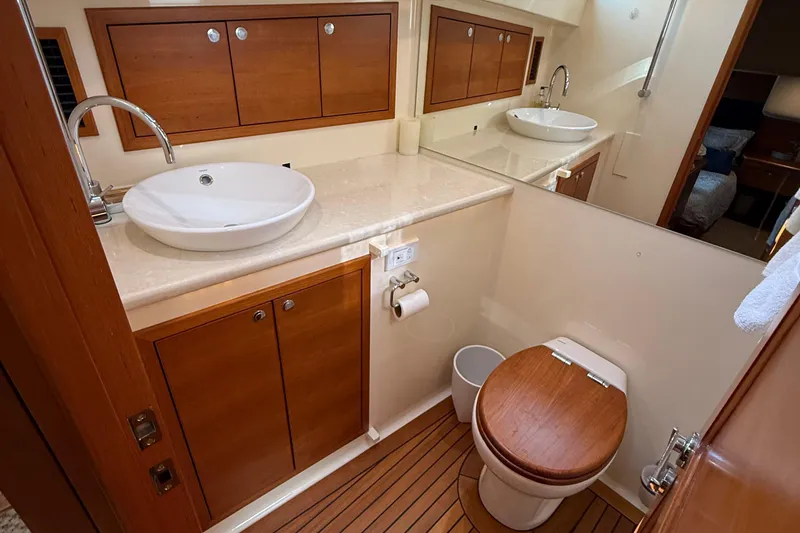 Slide: The Image of Luxurious bathroom in 2017 Grand Banks 44 Eastbay SX yacht with elegant wood accents. - 114