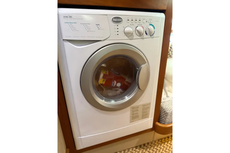Slide: The Image of Washing machine inside 2017 Grand Banks 44 Eastbay SX yacht interior. - 121