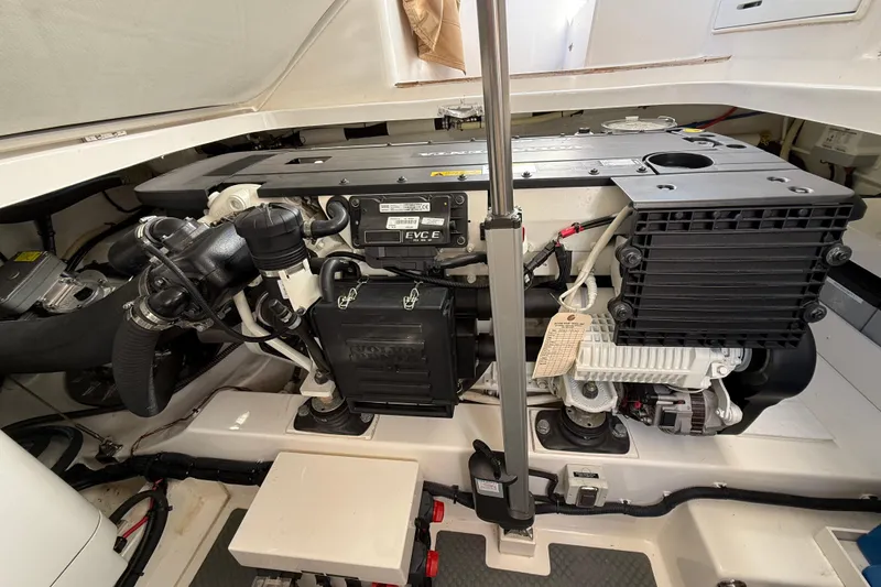Slide: The Image of Engine compartment of 2017 Grand Banks 44 Eastbay SX, showcasing a Volvo Penta engine. - 127