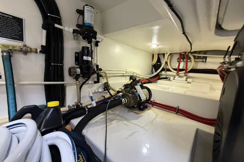 Slide: The Image of Engine room of 2017 Grand Banks 44 Eastbay SX with visible wiring and equipment. - 129