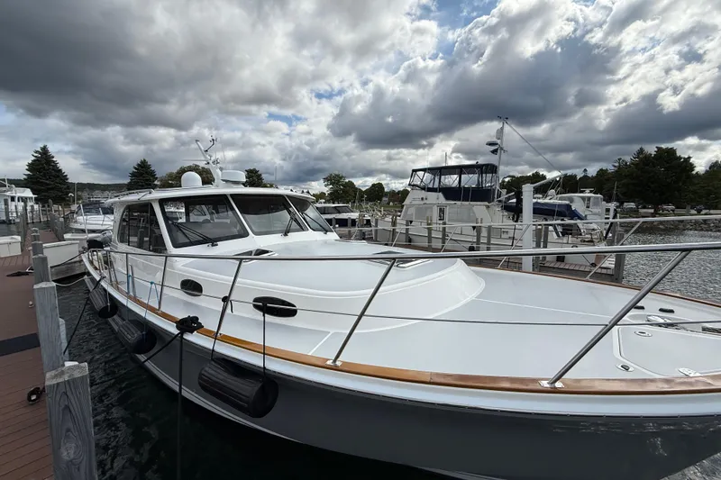 Slide: The Image of Bow view of 2017 Grand Banks 44 Eastbay SX yacht on water. - 20
