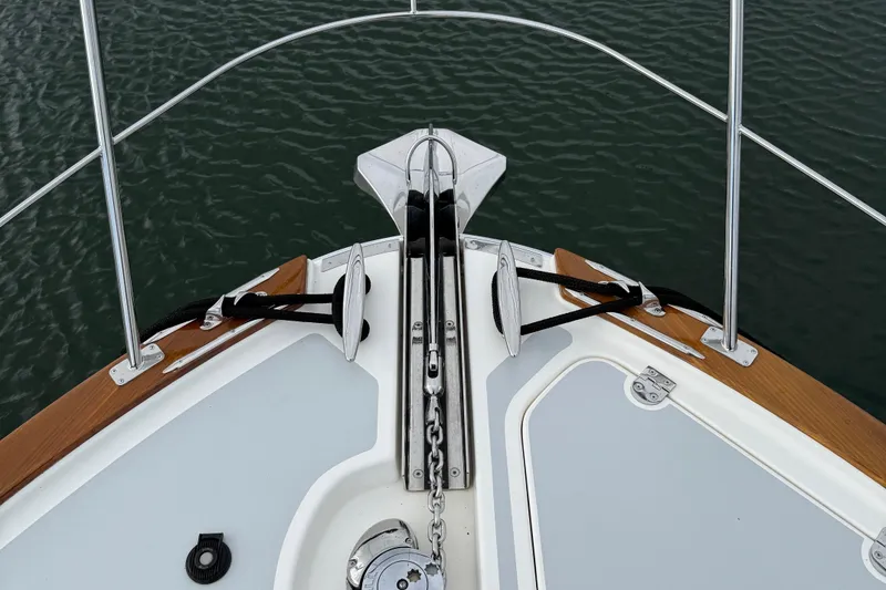 Slide: The Image of Bow of 2017 Grand Banks 44 Eastbay SX yacht with anchor and railing. - 21