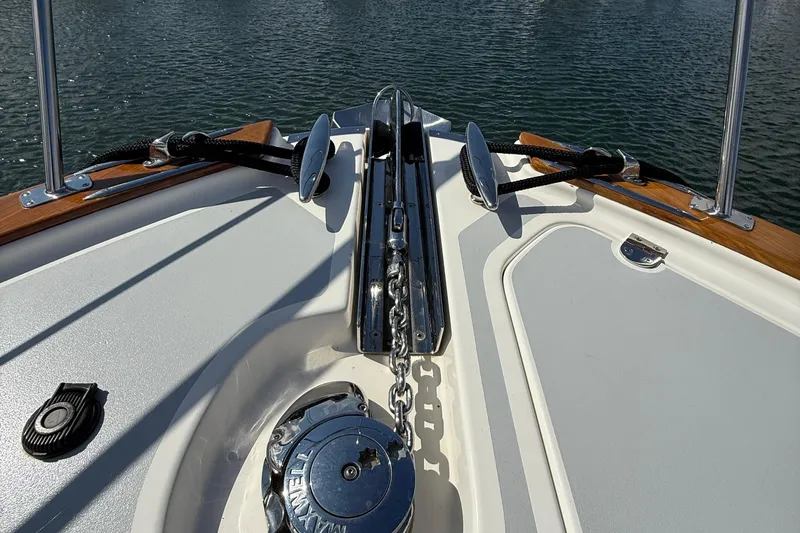 Slide: The Image of 2017 Grand Banks 44 Eastbay SX docked at a marina under cloudy skies. - 25