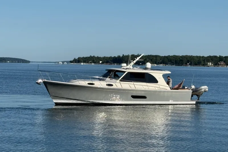 Slide: The Image of 2017 Grand Banks 44 Eastbay SX yacht cruising on calm waters. - 3