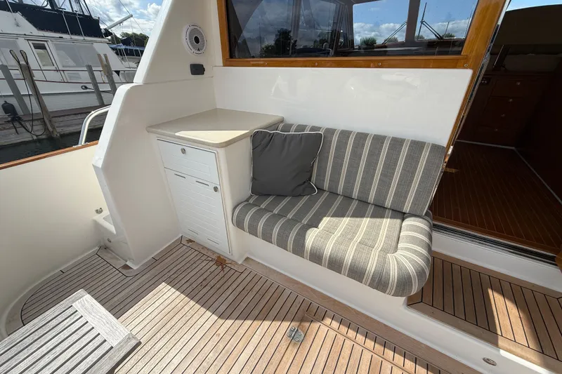 Slide: The Image of Wooden door and windows on 2017 Grand Banks 44 Eastbay SX yacht interior. - 44