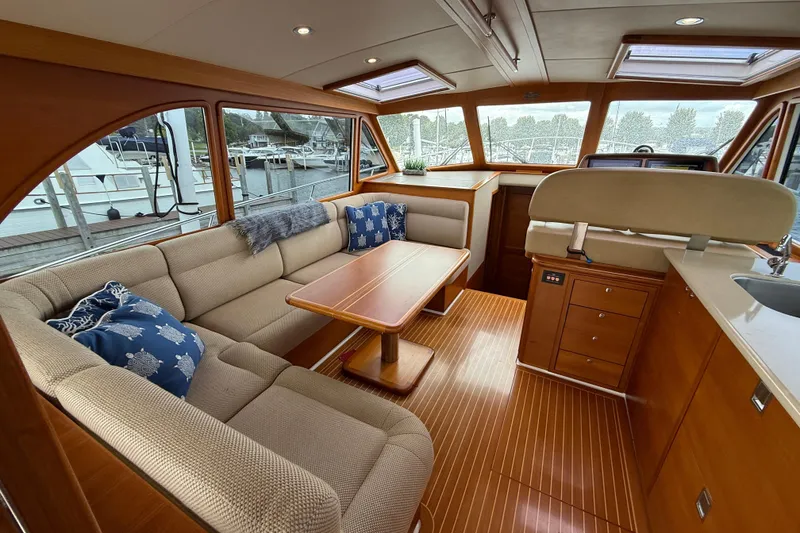 Slide: The Image of Luxurious interior of 2017 Grand Banks 44 Eastbay SX yacht with elegant seating and wooden finishes. - 46