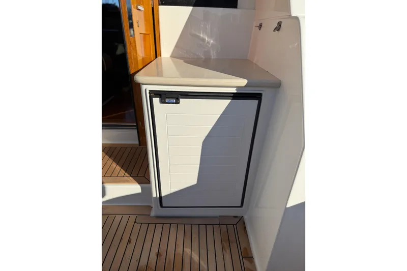 Slide: The Image of Luxurious 2017 Grand Banks 44 Eastbay SX yacht interior with plush seating and elegant wood finishes. - 47