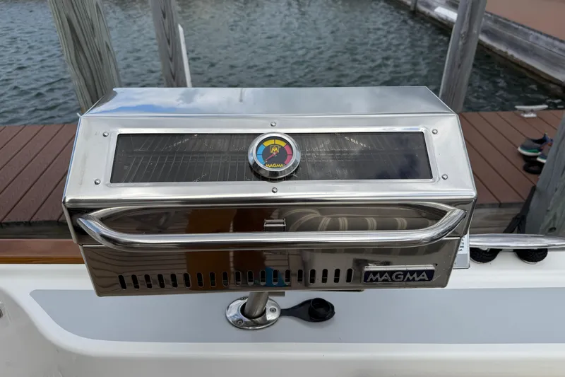 Slide: The Image of Luxurious 2017 Grand Banks 44 Eastbay SX yacht interior with elegant seating and wooden table. - 48