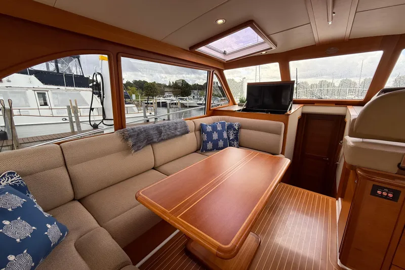 Slide: The Image of Luxurious interior of 2017 Grand Banks 44 Eastbay SX yacht with wood finish and modern amenities. - 53