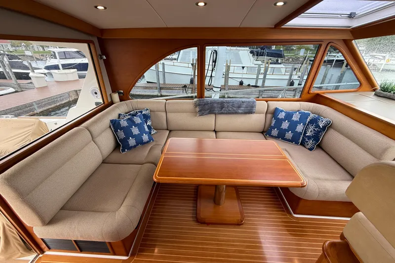 Slide: The Image of 2017 Grand Banks 44 Eastbay SX yacht interior with wooden cabinetry, sink, and microwave. - 54