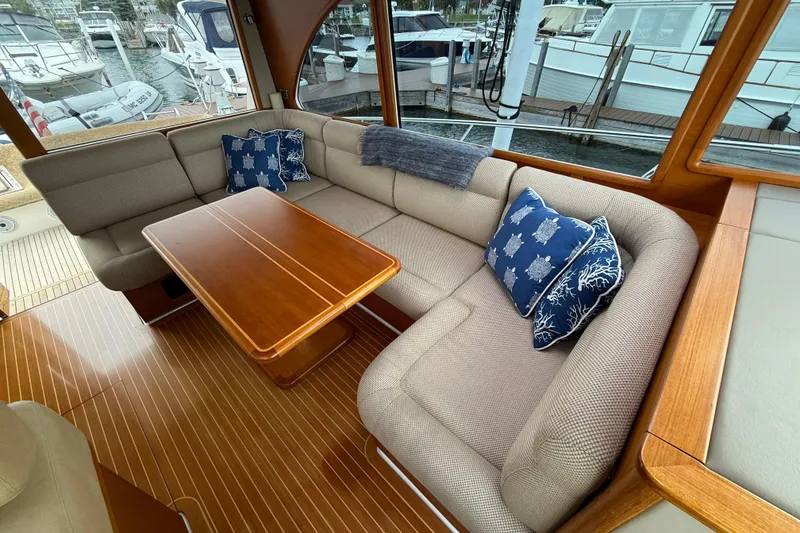 Slide: The Image of 2017 Grand Banks 44 Eastbay SX yacht interior with modern kitchen and wooden flooring. - 55