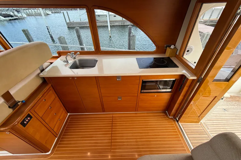 Slide: The Image of Built-in microwave in 2017 Grand Banks 44 Eastbay SX yacht kitchen. - 62