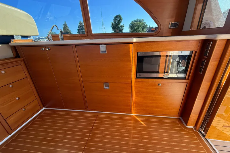 Slide: The Image of Luxurious interior of 2017 Grand Banks 44 Eastbay SX yacht with helm and seating area. - 64