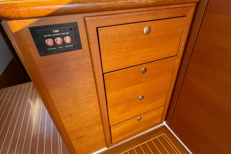 Slide: The Image of 2017 Grand Banks 44 Eastbay SX helm with leather seating and wooden dashboard. - 70