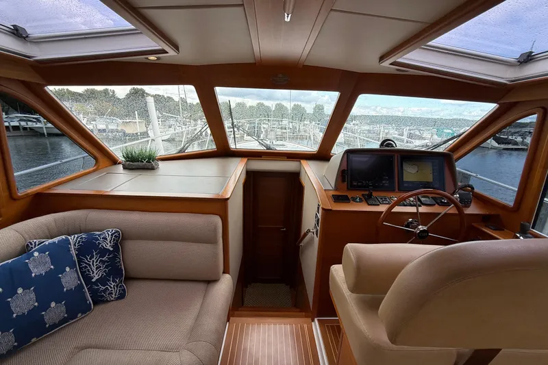Slide: The Image of Interior of 2017 Grand Banks 44 Eastbay SX yacht with helm and seating area. - 71