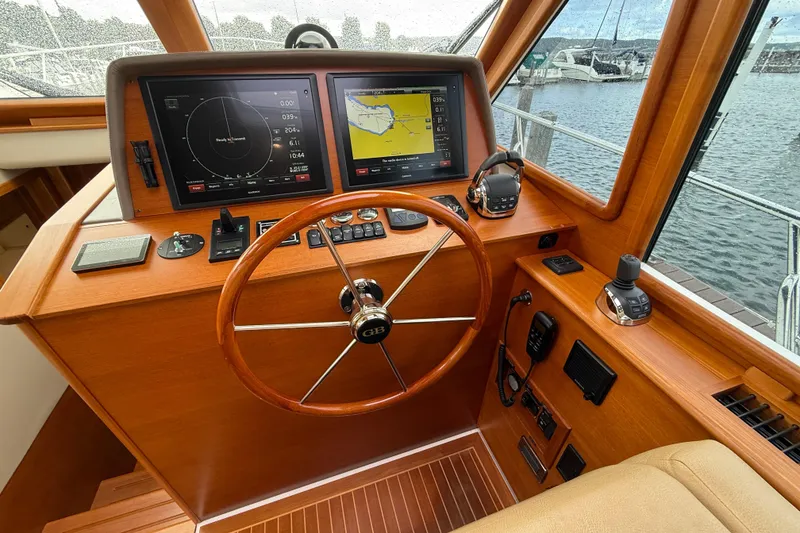 Slide: The Image of Interior hallway of 2017 Grand Banks 44 Eastbay SX yacht with wooden doors and carpet. - 80