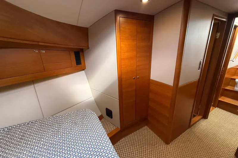Slide: The Image of Luxurious cabin interior of 2017 Grand Banks 44 Eastbay SX yacht with wooden finishes. - 93