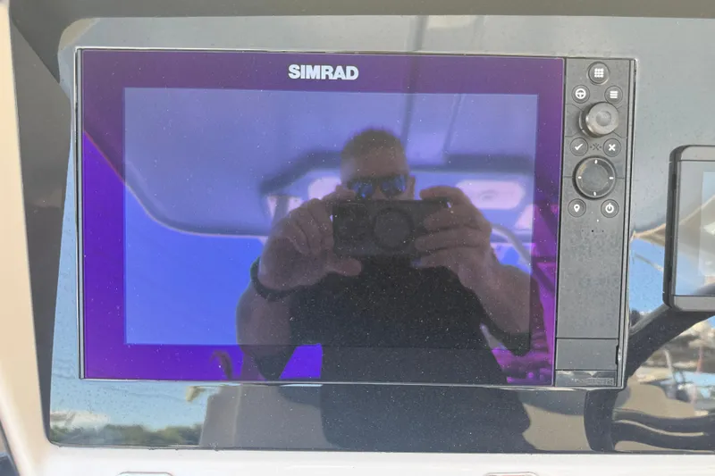 Slide: The Image of Simrad display on 2023 Robalo R302 Center Console boat dashboard. - 14