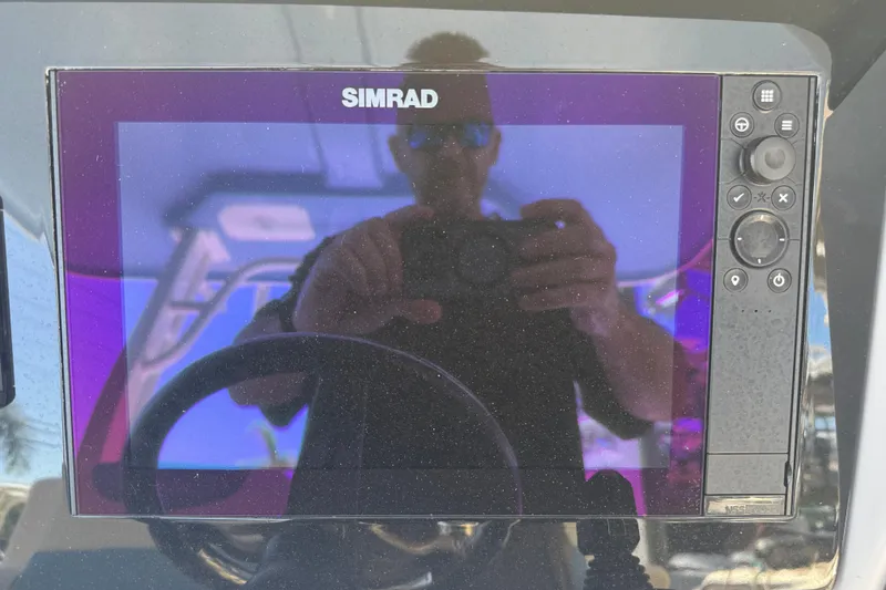 Slide: The Image of Simrad display on 2023 Robalo R302 Center Console boat dashboard. - 15