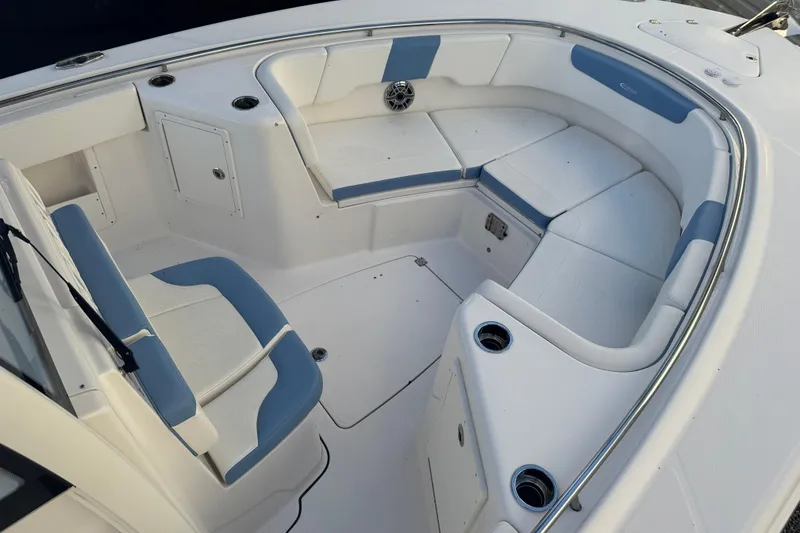 Slide: The Image of 2023 Robalo R302 Center Console boat with spacious seating and cup holders. - 20