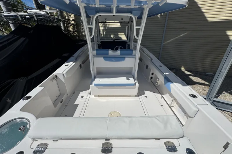 Slide: The Image of 2023 Robalo R302 Center Console boat interior with seating and storage compartments. - 3