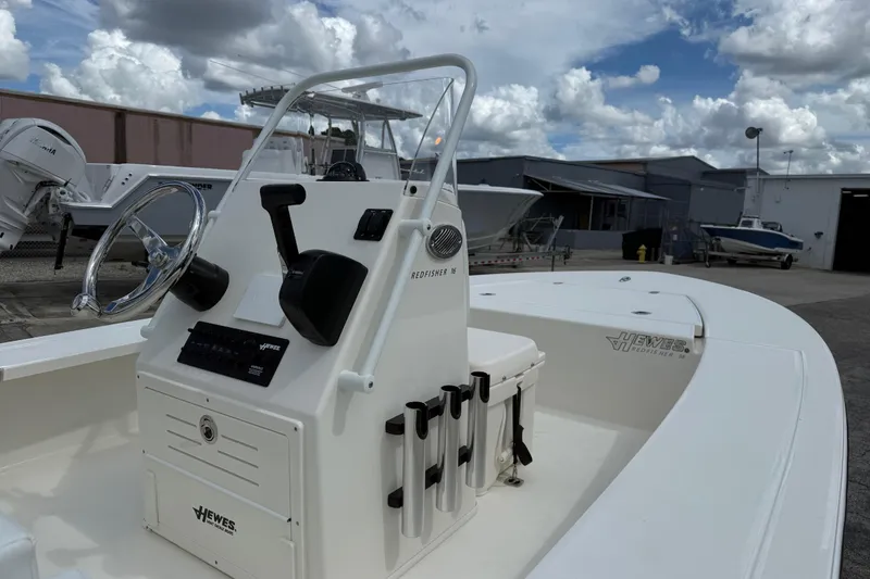 Slide: The Image of 2026 Hewes 16 Redfisher boat interior with steering wheel and control panel. - 6