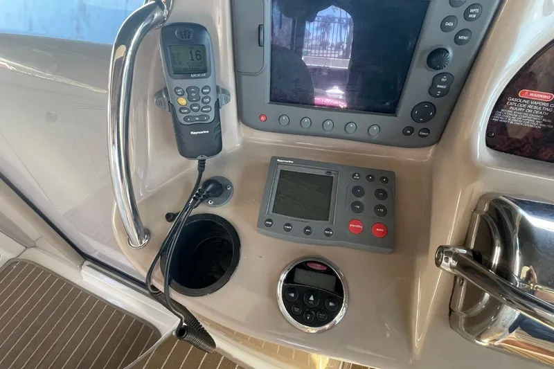 Slide: The Image of Interior view of 2006 Sea Ray 360 Sundancer yacht with covered dashboard and seating. - 22