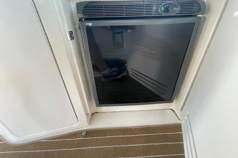 Slide: The Image of Compact refrigerator on 2006 Sea Ray 360 Sundancer yacht interior. - 23