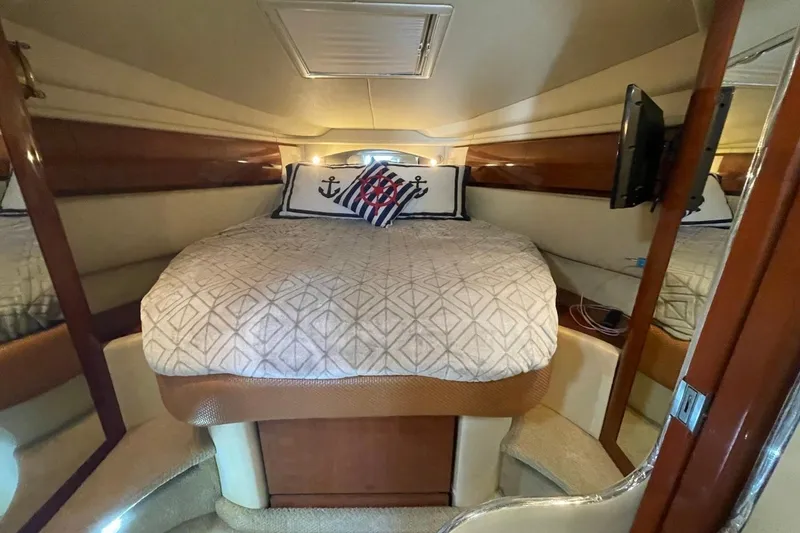Slide: The Image of Luxurious cabin interior of 2006 Sea Ray 360 Sundancer yacht with cozy bedding. - 30