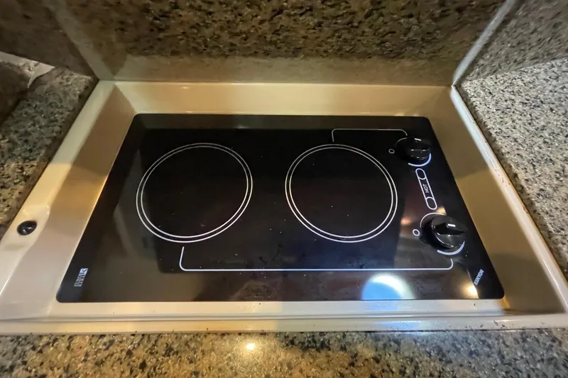 Slide: The Image of Built-in stovetop on 2006 Sea Ray 360 Sundancer yacht, featuring two burners. - 42