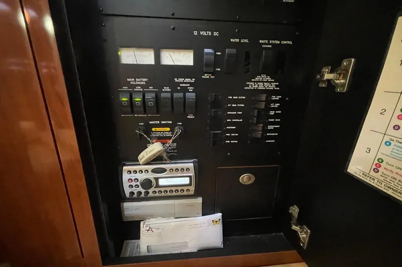 Slide: The Image of Electrical control panel inside a 2006 Sea Ray 360 Sundancer boat. - 47