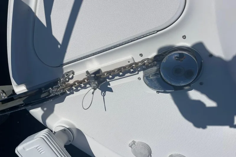 Slide: The Image of 2006 Sea Ray 360 Sundancer yacht with sunpad and hatch, docked near trees. - 48