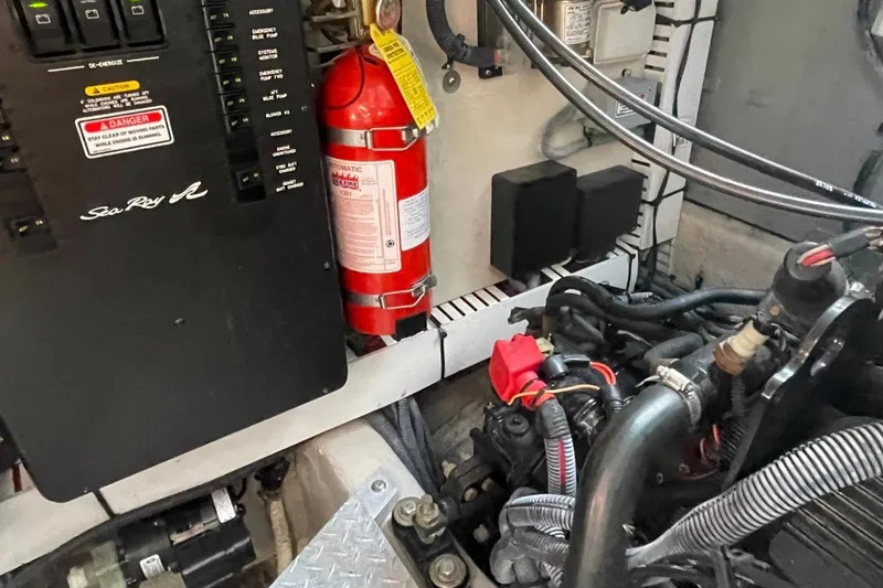 Slide: The Image of 2006 Sea Ray 360 Sundancer yacht bow, docked in a marina with calm waters. - 55