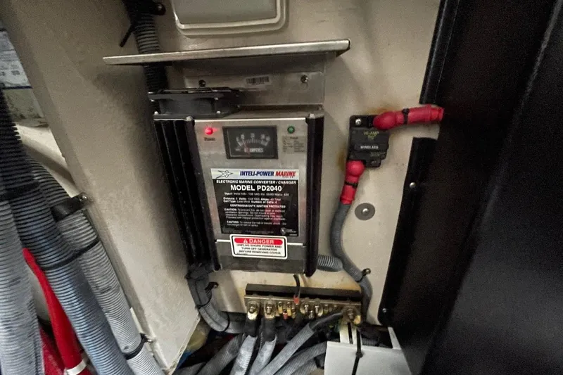 Slide: The Image of Main DC breaker panel on 2006 Sea Ray 360 Sundancer boat with fire extinguisher nearby. - 57