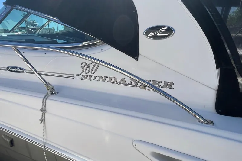 Slide: The Image of 2006 Sea Ray 360 Sundancer boat with sleek design and chrome accents. - 8