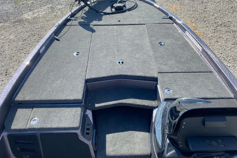 Slide: The Image of 2026 Skeeter ZX200 boat deck with carpeted storage compartments. - 13
