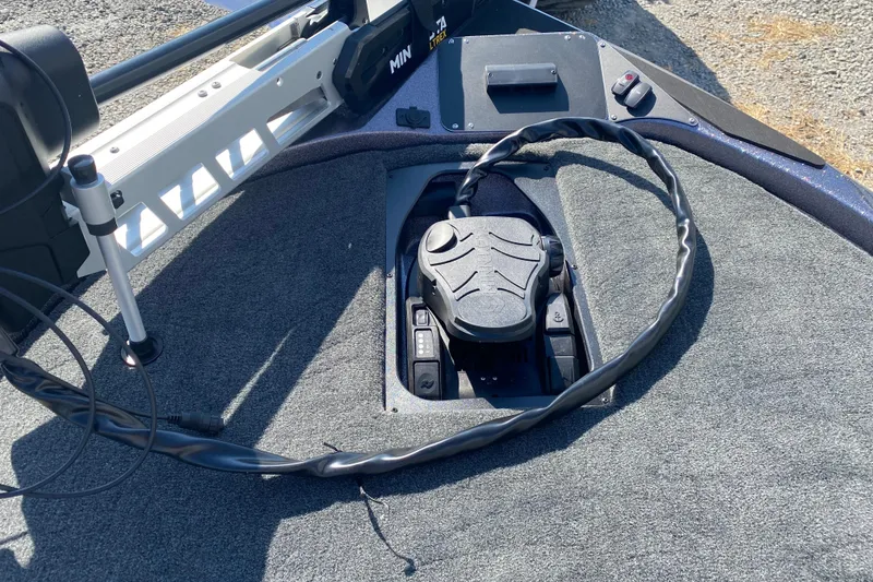 Slide: The Image of 2026 Skeeter ZX200 boat deck with trolling motor pedal and control panel. - 14