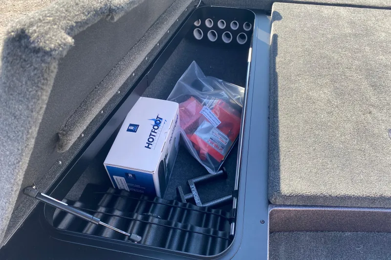 Slide: The Image of Storage compartment of 2026 Skeeter ZX200 boat with accessories and equipment. - 15