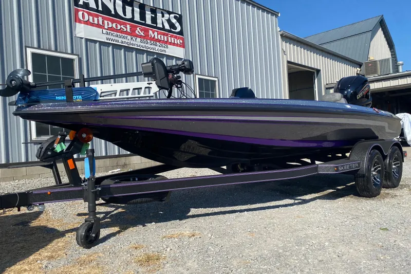 Slide: The Image of 2026 Skeeter ZX200 boat on trailer outside Anglers Outpost & Marine. - 4