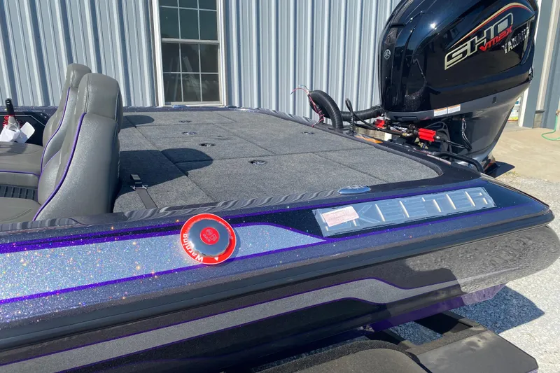 Slide: The Image of 2026 Skeeter ZX200 boat with sleek design and powerful engine, parked outdoors. - 8