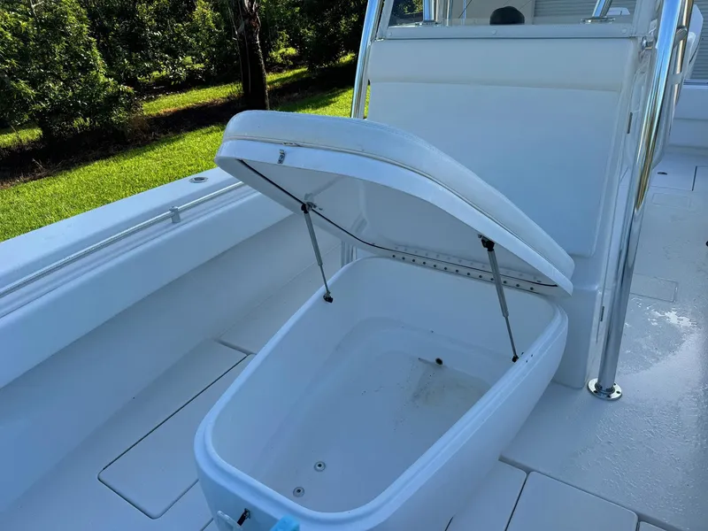 Slide: The Image of 2024 Contender 32 ST boat with open storage compartment on deck. - 3